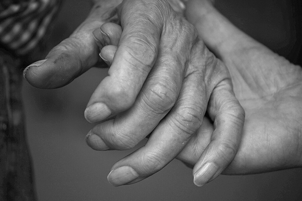Close-up of hands joined together